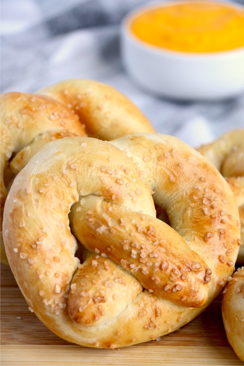 soft pretzel in front of cheese dip