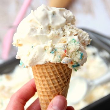 Birthday Cake Crunch Ice Cream - A delicious and fun no-churn ice cream with homemade vanilla magic shell and bits of vanilla sprinkle cake swirled throughout, then topped with birthday cake flavored candy!