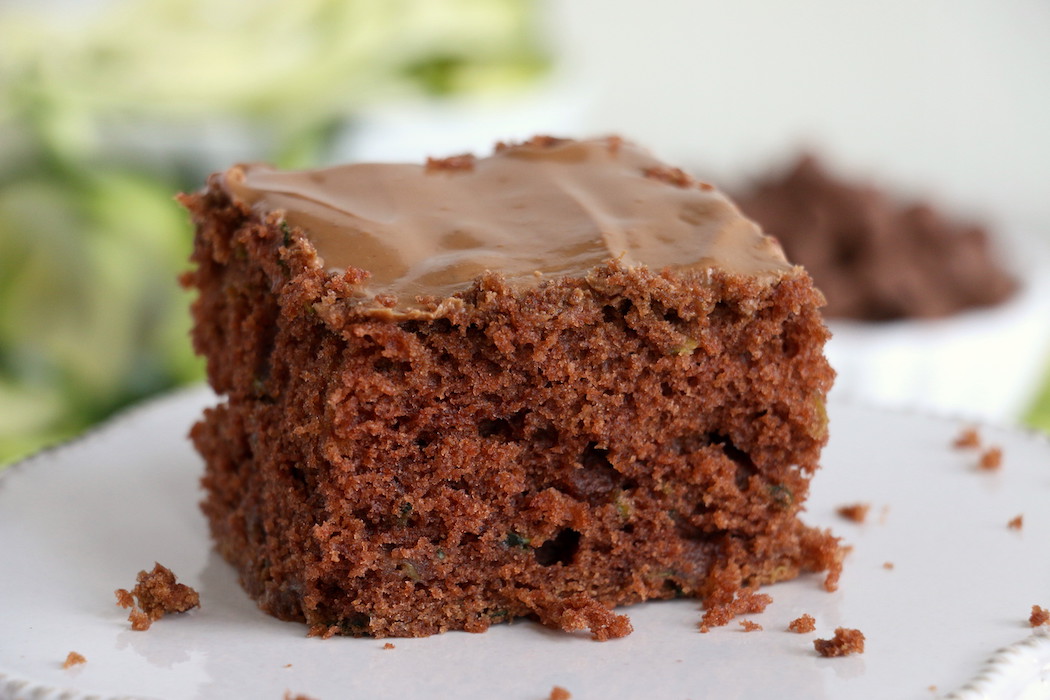 Zucchini Cake - Rich and moist chocolate zucchini cake topped with chocolate peanut butter frosting. 