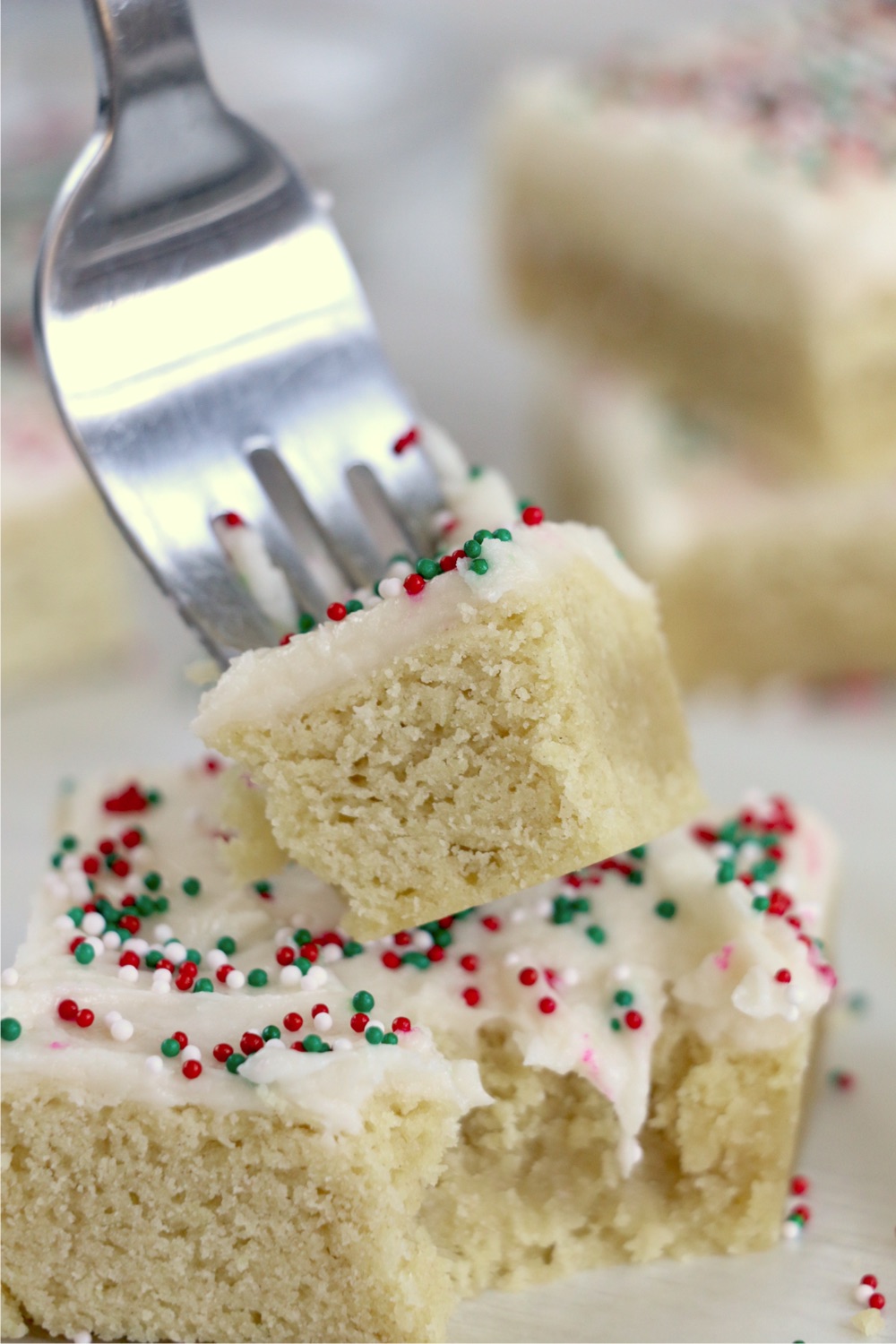 Fork holding piece of sugar cookie cake bar