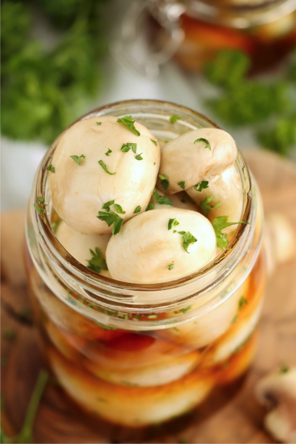 Quart jar filled to the brim with marinated mushrooms