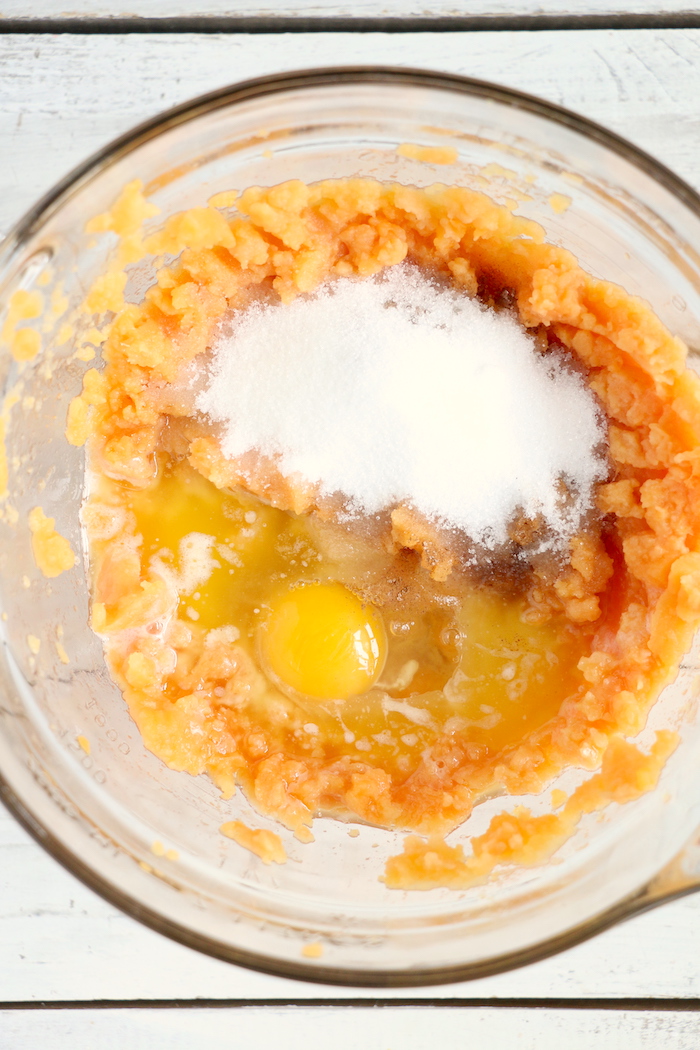 Easy Sweet Potato Casserole - An easy and delicious casserole that comes together with no scrubbing, boiling or baking the sweet potatoes! Topped with a sweet, salty and crunchy streusel, your guests will devour this simple and tasty side dish! 
