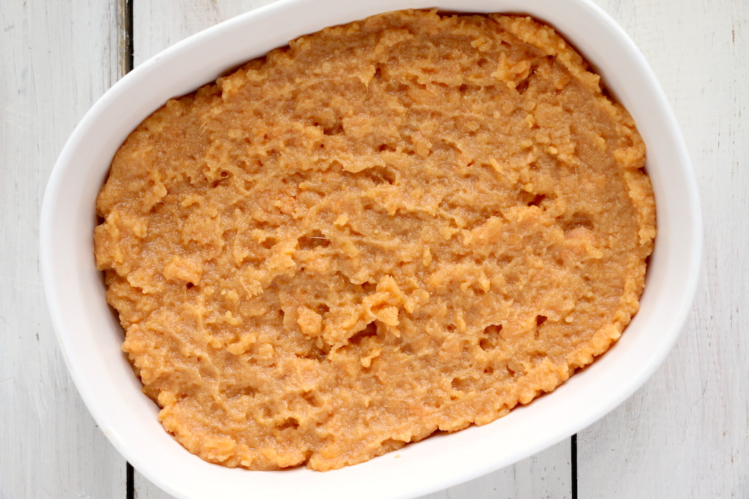 Easy Sweet Potato Casserole - An easy and delicious casserole that comes together with no scrubbing, boiling or baking the sweet potatoes! Topped with a sweet, salty and crunchy streusel, your guests will devour this simple and tasty side dish!
