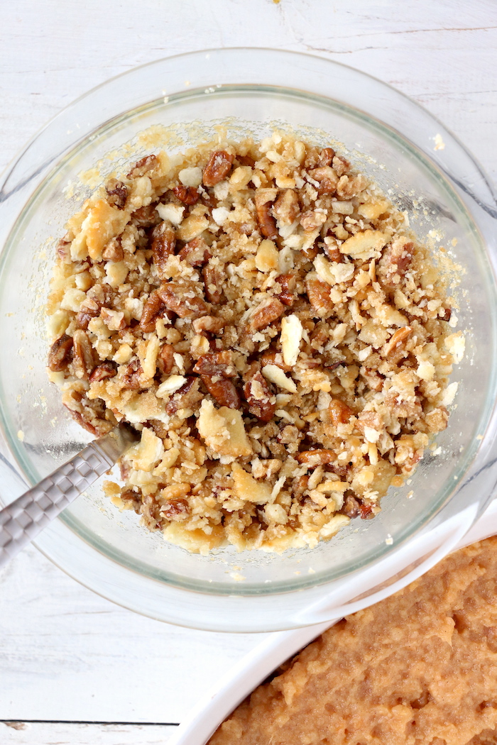 Easy Sweet Potato Casserole - An easy and delicious casserole that comes together with no scrubbing, boiling or baking the sweet potatoes! Topped with a sweet, salty and crunchy streusel, your guests will devour this simple and tasty side dish! 