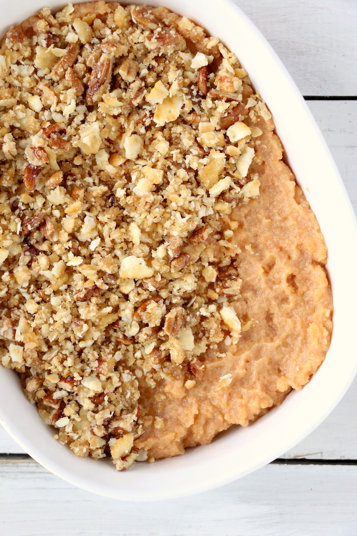 Easy Sweet Potato Casserole - An easy and delicious casserole that comes together with no scrubbing, boiling or baking the sweet potatoes! Topped with a sweet, salty and crunchy streusel, your guests will devour this simple and tasty side dish!