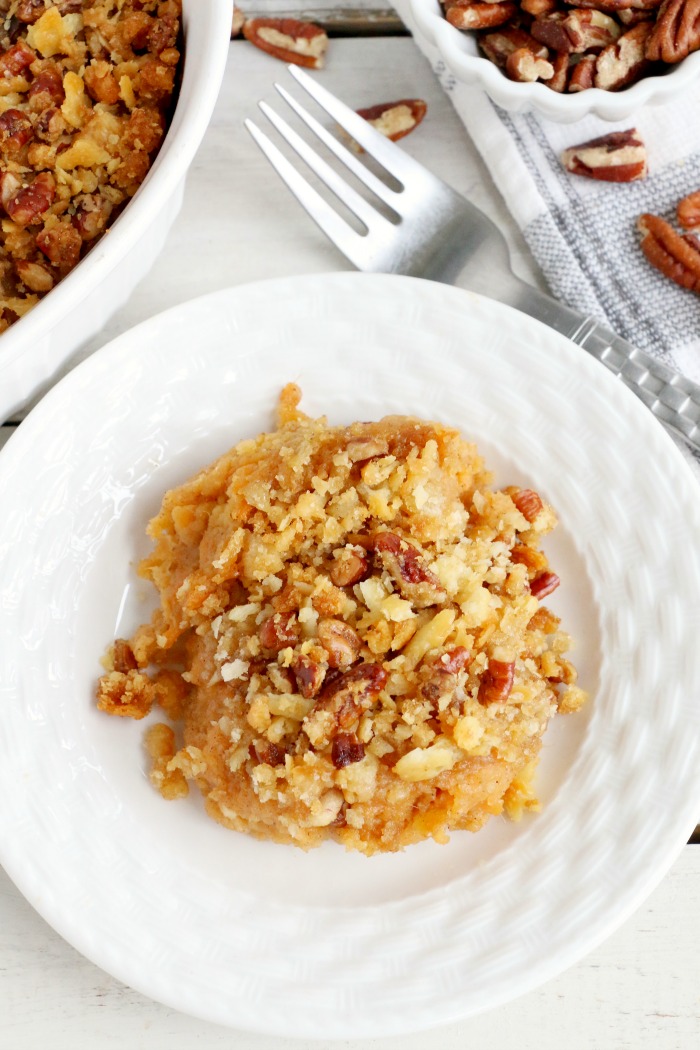Easy Sweet Potato Casserole - An easy and delicious casserole that comes together with no scrubbing, boiling or baking the sweet potatoes! Topped with a sweet, salty and crunchy streusel, your guests will devour this simple and tasty side dish! 