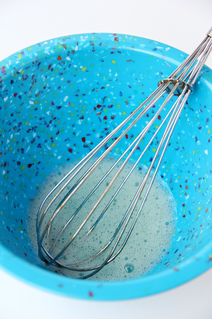 whisking egg whites in a bowl