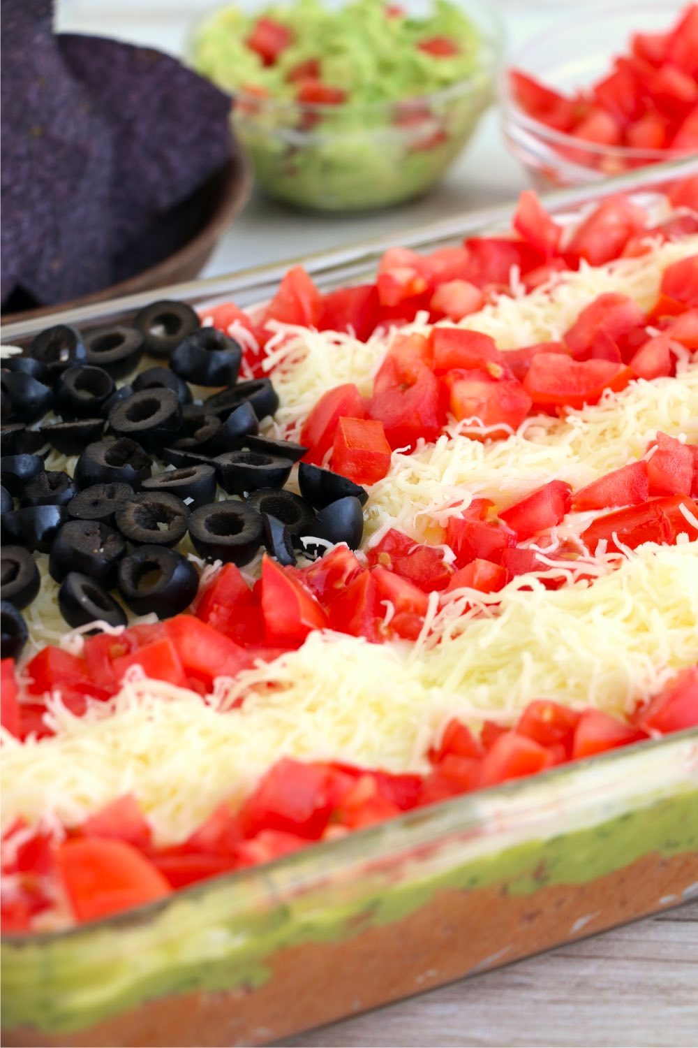 glass pan with taco dip designed like a flag