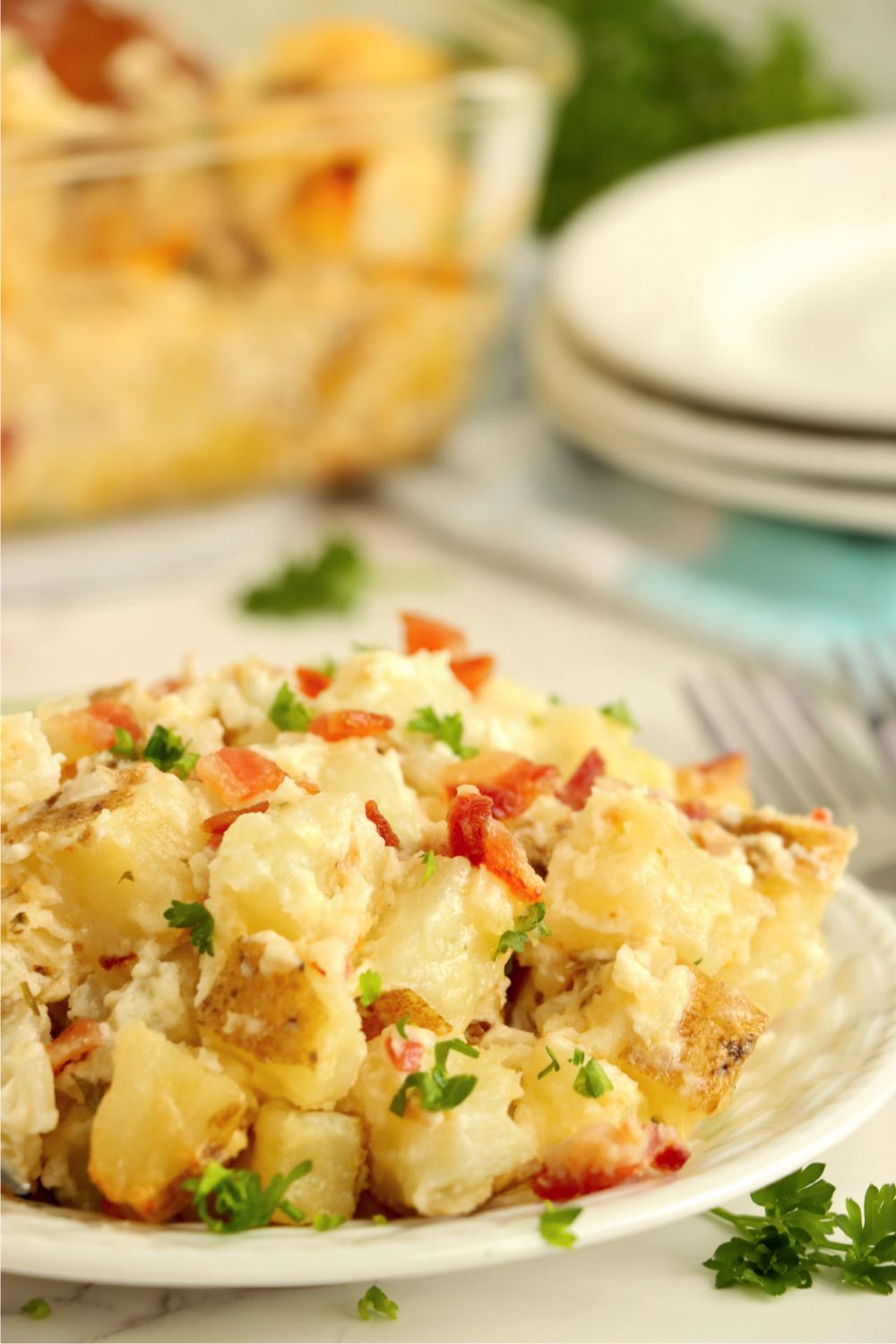 A serving of potato casserole on a plate 