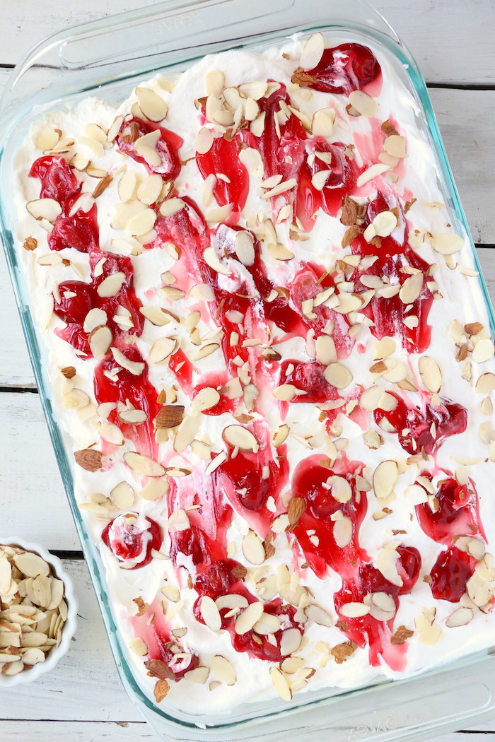 No Bake Cherry Dump Cake - An easy, no-bake cherry trifle dessert withÂ layers of angel food cake, sour cream, pudding, cherry pie filling and whipped topping.