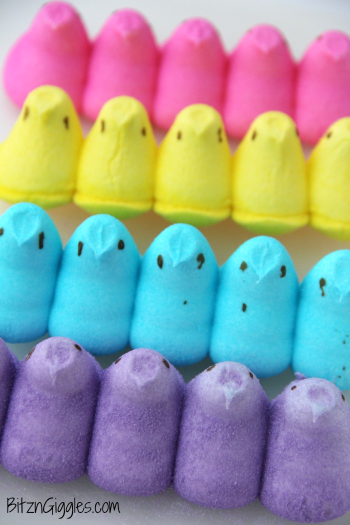 Peeps Cake With Marshmallow Frosting - This cake incorporates bits of Peeps right into the baking process, producing a colorful and slightly sweetened cake with a fluffy, marshmallow frosting that literally melts in your mouth!