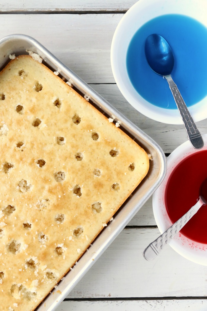 Red White and Blue Jello Poke Cake - A colorful and delicious cake, perfect for Memorial Day, the 4th of July or any patriotic celebration! The Jello is what makes it super moist!