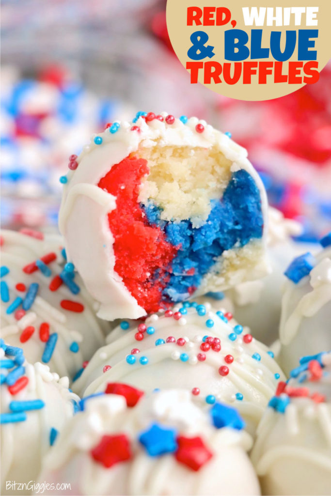 A red, white and blue truffle with sprinkles sitting on a stack of more truffles.