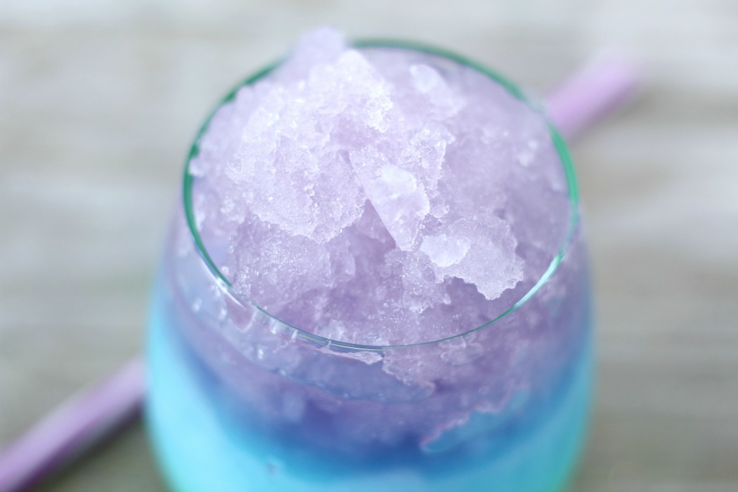 Mermaid Slush - A fun and colorful kid-friendly layered drink perfect for birthdays and parties! #slush #kidsdrink #slushie #BitznGiggles #mermaid #recipe #drinkrecipes #drinks #nonalcoholicdrinks #slushies 