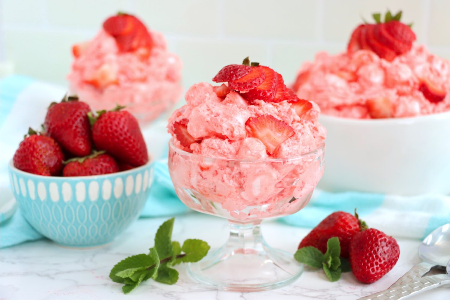 glass dessert dish filled with strawberry fluff