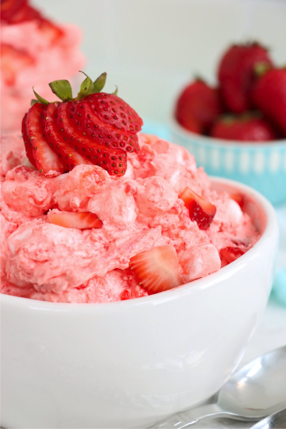 up close view of strawberry salad in white bowl