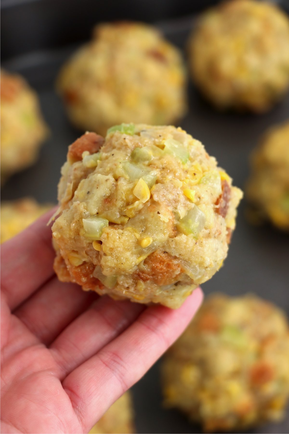hand holding a ball of Thanksgiving stuffing